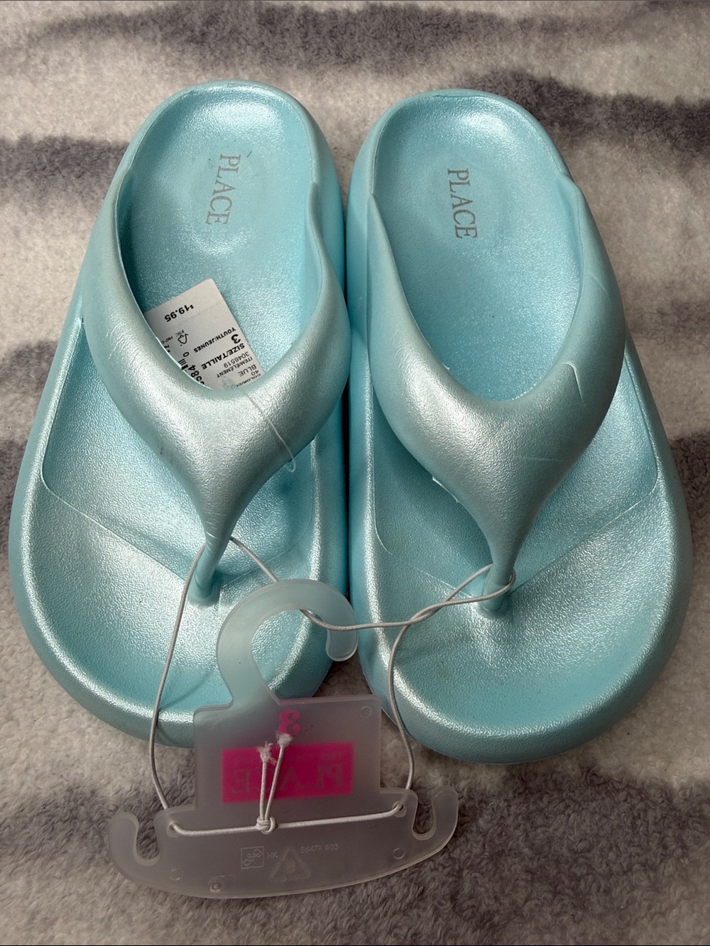 Place Light Blue Metallic Foam Flip Flops